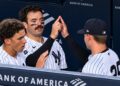 George Lombard Jr. Austin Wells, and Will Warren celebrate the Yankees' 6-1 win over the Rockies, New York, September 9, 2026.