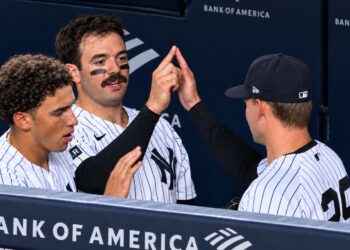 George Lombard Jr. Austin Wells, and Will Warren celebrate the Yankees' 6-1 win over the Rockies, New York, September 9, 2026.