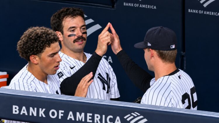 George Lombard Jr. Austin Wells, and Will Warren celebrate the Yankees' 6-1 win over the Rockies, New York, September 9, 2026.