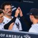George Lombard Jr. Austin Wells, and Will Warren celebrate the Yankees' 6-1 win over the Rockies, New York, September 9, 2026.