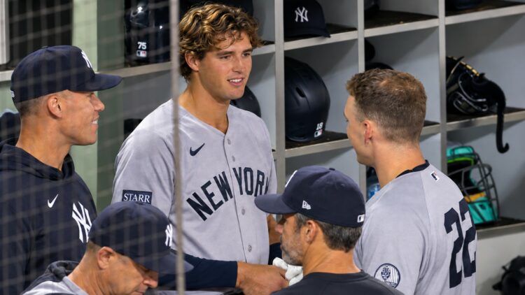 Spencer Jones talks to Judge and rice in the dugout during the Yankees' 3-2 loss to the Padres, San Diego, September 4, 2026.