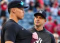 Yankees' manager Aaron Boone and aaron judge. Aug. 2025.