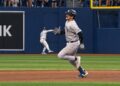 Austin Wells runs to third from second despite 3B coach asking him to stop. He was caught in the Yankees' 1-0 ALDS loss to the Rays, Tampa, October 3, 2026.
