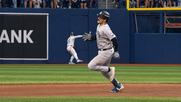 Austin Wells runs to third from second despite 3B coach asking him to stop. He was caught in the Yankees' 1-0 ALDS loss to the Rays, Tampa, October 3, 2026.