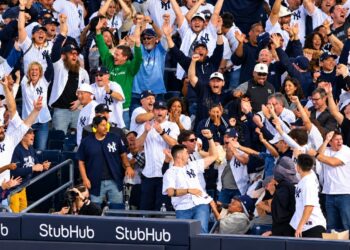 Baseball fans celebrate after the Yankees' 9-2 rout of the Red Sox at Yankee Stadium, New York, September 30, 2026 to advance to MLB ALDS.