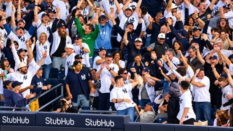 Baseball fans celebrate after the Yankees' 9-2 rout of the Red Sox at Yankee Stadium, New York, September 30, 2026 to advance to MLB ALDS.
