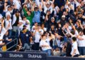 Baseball fans celebrate after the Yankees' 9-2 rout of the Red Sox at Yankee Stadium, New York, September 30, 2026 to advance to MLB ALDS.