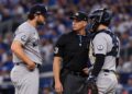 Gerrit Cole talks to Austin Wells during the Yankees' 1-0 ALDS loss to the Rays, Tampa, October 3, 2026.