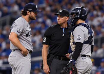 Gerrit Cole talks to Austin Wells during the Yankees' 1-0 ALDS loss to the Rays, Tampa, October 3, 2026.