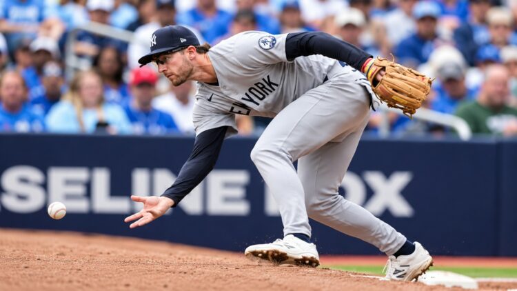 3B Ryan McMahon let a Yandy Diaz chopper skip off his glove on Cam Schlittler's second pitch in the Yankees' 5-2 ALDS loss to the Rays, Tampa, October 5, 2026.