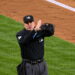 Umpire signals fan interference that overturned an Anthony Volpe HR in the Yankees' 4-3 ALDS loss to the Rays, New York, October 7, 2026.