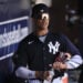 New York Yankees right fielder Juan Soto stands in the dugout before a spring training baseball game against the Boston Red Sox Wednesday, March 13, 2024, in Tampa, Fla.