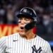 Aaron Judge hits a go-ahead grand slam for his 52nd home run, while Yankees fans celebrate. Luke Weaver records the save in a crucial 5-4 win against the Red Sox, extending the Yankees' AL East lead.