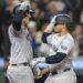 New York Yankees’ Jasson Dominguez, right, celebrates with Anthony Rizzo after hitting a solo home run during the fifth inning of a baseball game against the Seattle Mariners, Tuesday, Sept. 17, 2024, in Seattle.