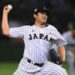 TOKYO, JAPAN - NOVEMBER 21: Tomoyuki Sugano #11 of Japan pitches in the top half of fifth inning during the WBSC Premier 12 third place play off match between Japan and Mexico at the Tokyo Dome on November 21, 2015 in Tokyo, Japan