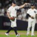 New York Yankees pitcher Carlos Rodón motions to the dugout after knocking down a line drive ball during the third inning of Game 2 of the American League baseball playoff series against the Kansas City Royals, Monday, Oct. 7, 2024, in New York. 