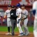 New York Yankees shortstop Anthony Volpe applies a hard tag to Kansas City Royals' Maikel Garcia during a double play on October 10, 2024, sparking tensions that briefly led to benches clearing in the sixth inning of Game 4 of the American League Division Series