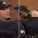 Umpire Mike Estabrook is seen in a discussion with Aaron Boone and the Yankees' staff during a controversial moment in the seventh inning of the ALCS opener, where the Yankees secured a 5-2 victory over the Guardians on October 14, 2024.