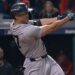 Yankees' Giancarlo Stanton hitting a two-run homer against the Cleveland Guardians during the 10th inning in Game 5 of the baseball AL Championship Series Saturday, Oct. 19, 2024, in Cleveland.