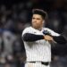 New York Yankees’ Juan Soto takes off his batting gloves after grounding out against the New York Yankees to end the third inning in Game 3 of the baseball World Series, Monday, Oct. 28, 2024, in New York. 